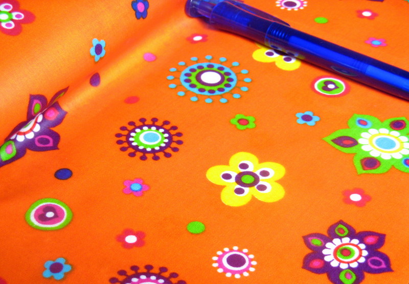 beschichtete Baumwolle / Wachstuchstück | Blumenfreunde | orange